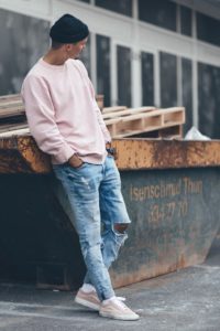 male model wearing a pink sweater